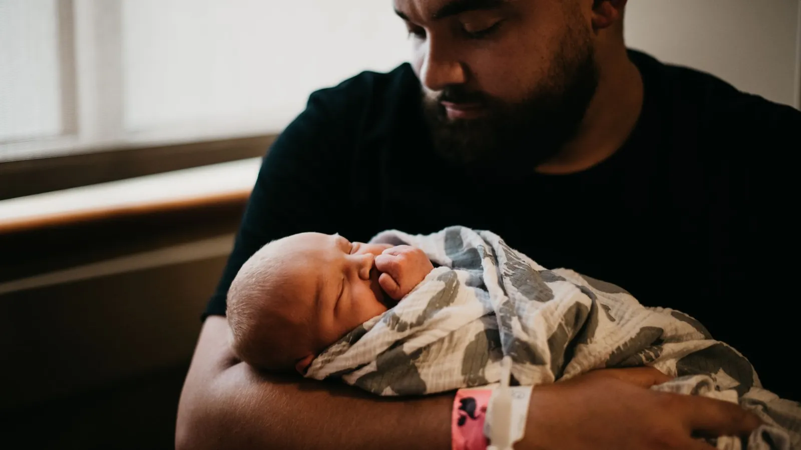 A father holding a baby