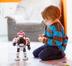 Child Playing With A Robot Toy