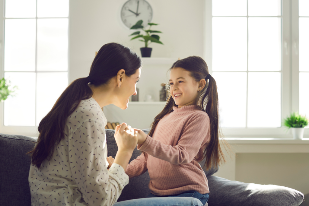 woman with excited child indoors