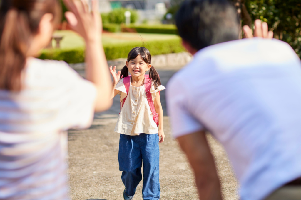 little girl walking to parents